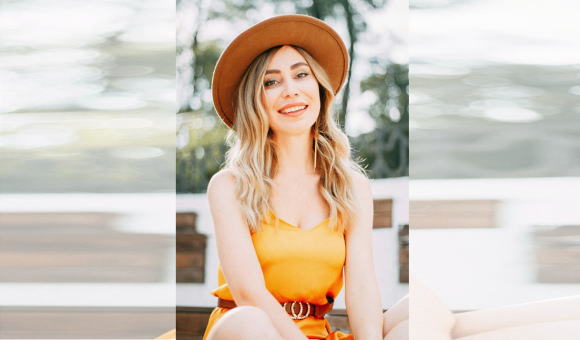 A wide-brimmed hat and a statement belt